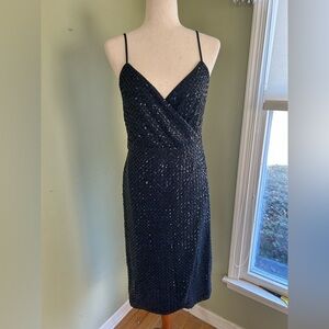 Nanette by Nanette Lepore black sequin dress. Spaghetti straps/wrap look Size 10